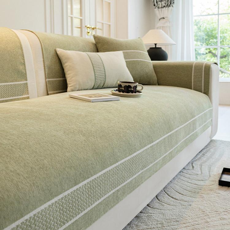 Two-Tone Bordered Chenille Modular Couch Cover styled on a sofa Main image