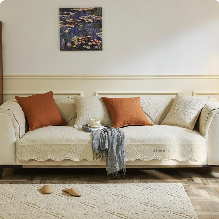 White couch cover protecting a full sofa seat