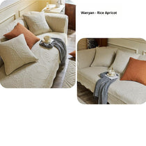 Beige couch cover with orange accent cushions