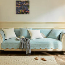 Light blue botanical couch cover in a bright living room