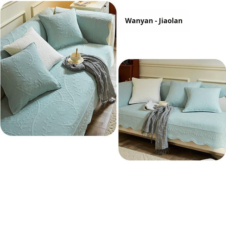 Light blue couch cover with contrasting white cushions