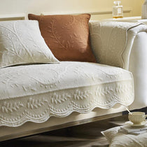 White and orange cotton couch covers styled together