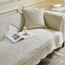 Beige option for the scalloped botanical cotton couch cover
