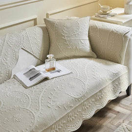 Beige option for the scalloped botanical cotton couch cover