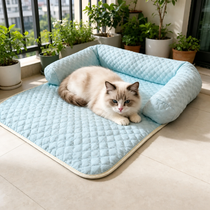 Cat lounging on a blue quilted cooling sofa bed